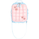 A pastel pink quilted backpack with light blue trim and straps, decorated with four pink glittery smiley face charms, shown against a plain white background.