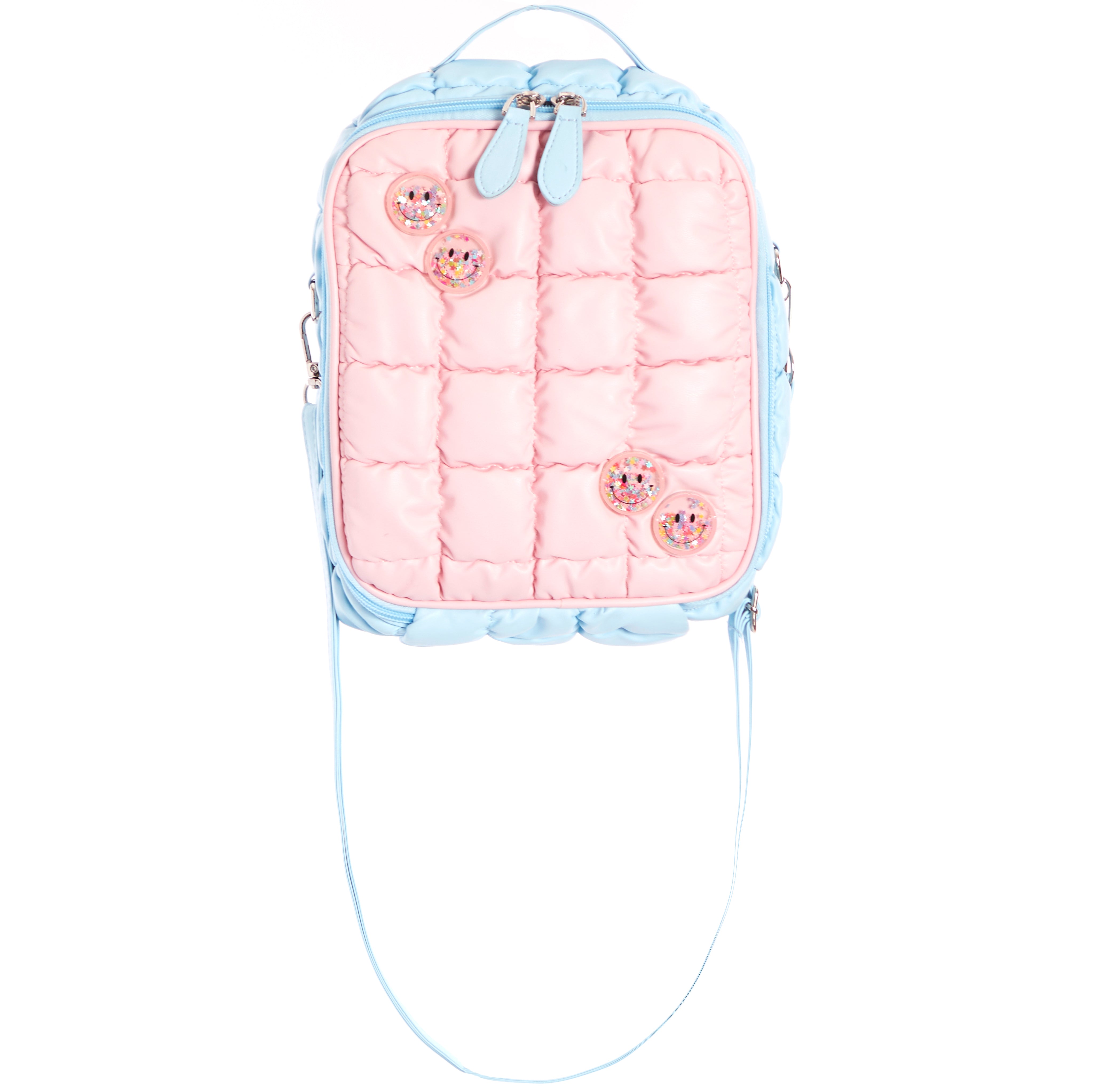 A pastel pink quilted backpack with light blue trim and straps, decorated with four pink glittery smiley face charms, shown against a plain white background.