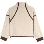A cropped sherpa fleece jacket with a high collar, featuring a cream-colored body with contrasting dark brown trim along the shoulders, sleeves, and hem.