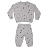 A two-piece kids' loungewear set consisting of a long-sleeve sweatshirt and matching jogger pants, both in light gray with a small black lightning bolt pattern, displayed on a solid white background.