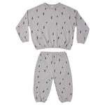 A two-piece kids' loungewear set consisting of a long-sleeve sweatshirt and matching jogger pants, both in light gray with a small black lightning bolt pattern, displayed on a solid white background.