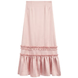 A light pink midi skirt with a textured fabric, featuring a double-tiered ruffle hem design, shown against a plain white background.