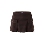 A dark brown houndstooth mini skirt with a high waistband, front pleats, and two side flap pockets with button closures, shown against a plain white background.