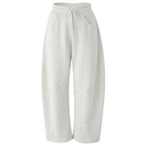Light heather gray wide-leg sweatpants with an elastic waistband and drawstring, shown against a plain white background.