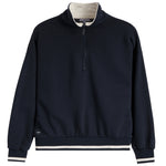 A navy blue quarter-zip sweatshirt with a contrasting cream inner collar, cream ribbed hem, and cream and navy striped cuffs, shown on a plain white background.