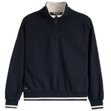 A navy blue quarter-zip sweatshirt with a contrasting cream inner collar, cream ribbed hem, and cream and navy striped cuffs, shown on a plain white background.
