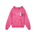 A pink heathered hoodie sweatshirt featuring the text 'Boys Lie' across the chest in stylized white, pink, and navy blue lettering, with a front kangaroo pocket and a small black logo patch on the pocket.