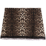 A leopard print skirt featuring a brown, black, and beige animal pattern with a black lace hem, displayed flat against a white background.