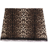 A leopard print skirt featuring a brown, black, and beige animal pattern with a black lace hem, displayed flat against a white background.
