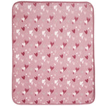 A square pink blanket with rounded corners, featuring an all-over pattern of small hearts in dark red, white, and light pink, shown flat against a white background.
