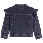 A dark washed denim jacket shown from the back, featuring ruffled detailing on the shoulders and buttoned cuffs, set against a plain white background.