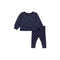 A toddler girl's two-piece pajama set in navy blue, featuring a long-sleeve top and matching leggings, both decorated with a white star pattern.