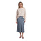 A woman modeling a cream knit sweater and a slate blue satin midi skirt against a plain white background.
