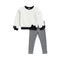 A children's two-piece outfit set featuring a fuzzy off-white long-sleeve top with black trim and bow details on the cuffs and hem, paired with black and white gingham checkered pants, shown against a plain white background.