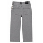 Back view of a pair of gray denim jeans featuring a decorative silver beaded chain detail on the left side of the back pocket.