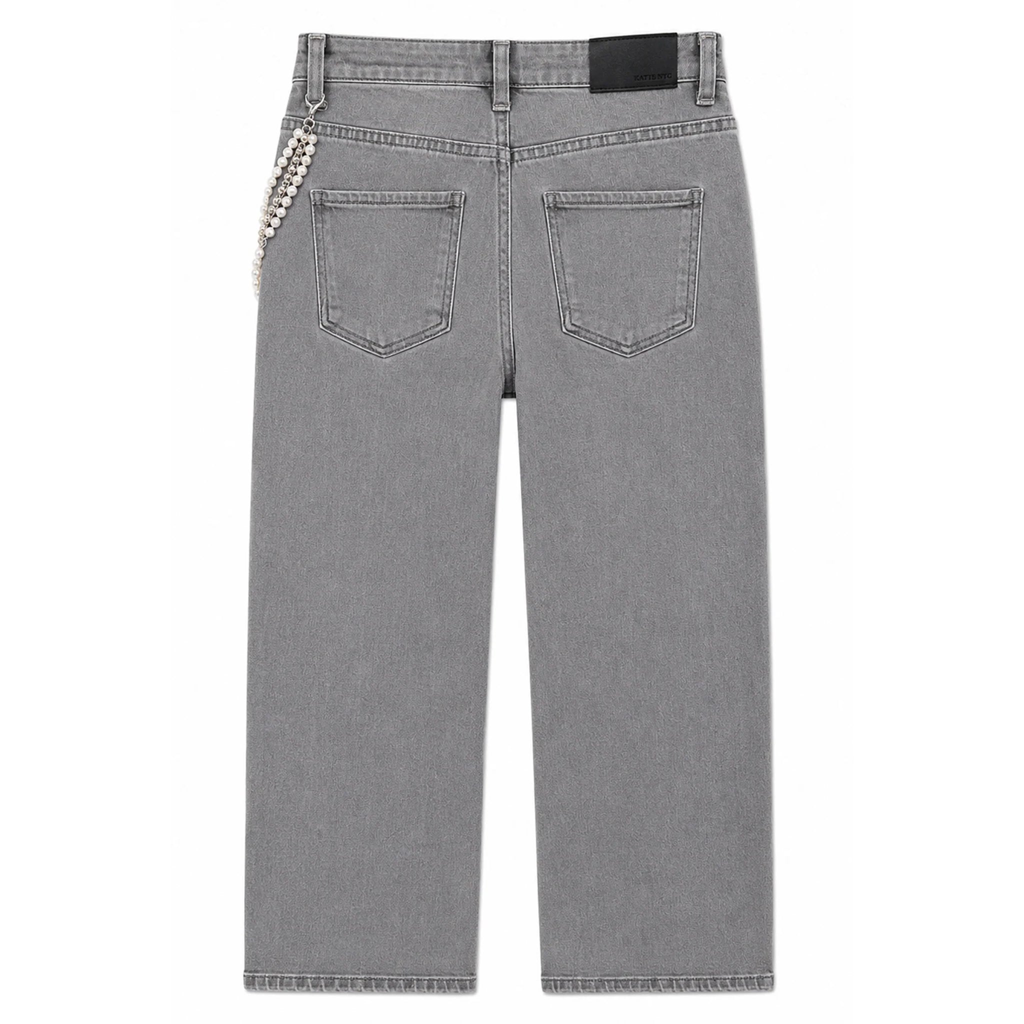 Back view of a pair of gray denim jeans featuring a decorative silver beaded chain detail on the left side of the back pocket.