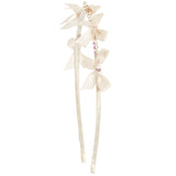 An off-white satin hair accessory featuring three layered bows, rhinestone accents, and a decorative top, attached to two long ribbons on a plain white background.