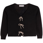 A black knit cardigan sweater with a V-neck, long sleeves, and three decorative beige rope bow closures down the front, shown flat on a white background.