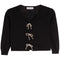 A black knit cardigan sweater with a V-neck, long sleeves, and three decorative beige rope bow closures down the front, shown flat on a white background.