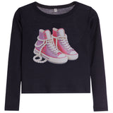 A dark navy blue long-sleeve crop top featuring a graphic of pink high-top sneakers wrapped in white pearl chains on the front, set against a plain white background.