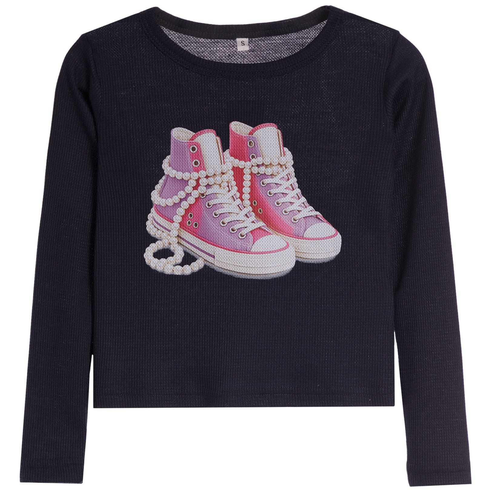 A dark navy blue long-sleeve crop top featuring a graphic of pink high-top sneakers wrapped in white pearl chains on the front, set against a plain white background.