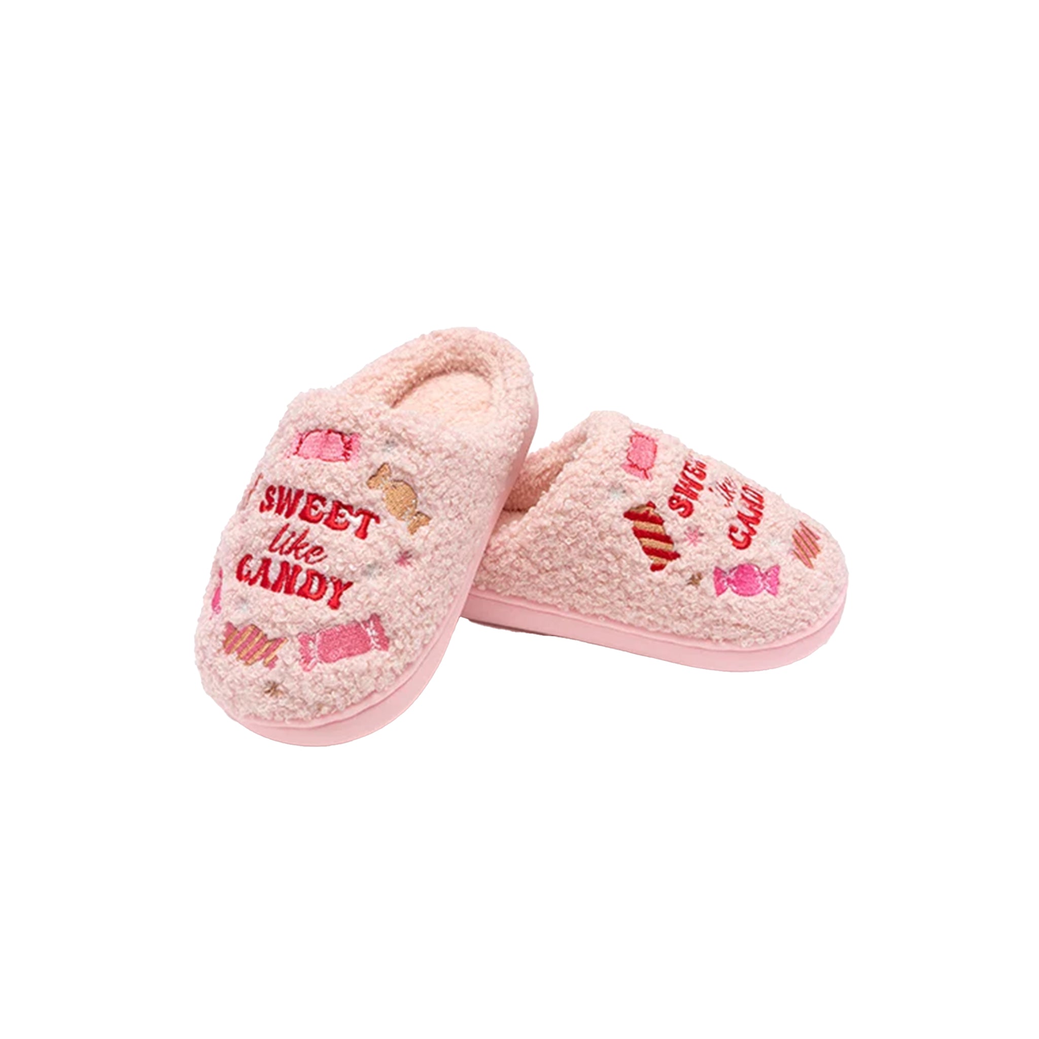 A pair of pink fuzzy slip-on slippers with candy-themed graphics and the words 'SWEET like CANDY' on a plain white background.