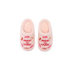 A pair of plush pink slipper shoes with 'SWEET like CANDY' embroidered in red on the front, decorated with candy illustrations in pink, red, and orange.