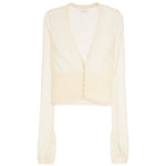 A cream-colored long-sleeve cardigan with a deep V-neckline, featuring a structured, slightly padded yoke and a sheer, lightweight fabric.
