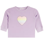 A lavender waffle-knit long-sleeve baby shirt with a central iridescent pastel heart patch, shown flat on a white background.