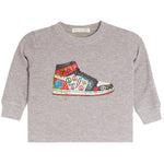 A toddler's long-sleeve heather gray shirt featuring a colorful graphic of a high-top sneaker decorated with peace signs, lightning bolts, and graffiti-style text.