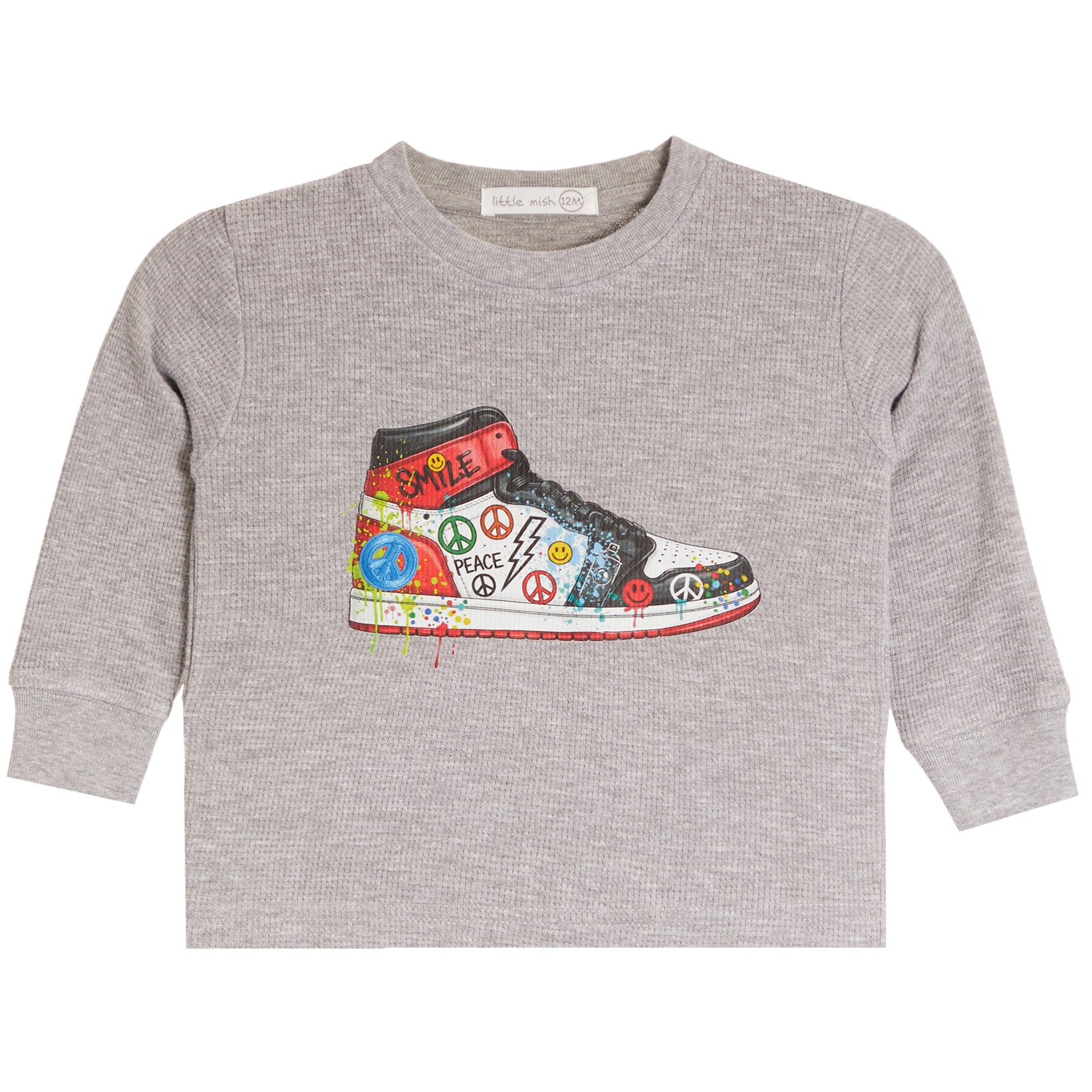 A toddler's long-sleeve heather gray shirt featuring a colorful graphic of a high-top sneaker decorated with peace signs, lightning bolts, and graffiti-style text.