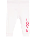 White ribbed knit baby leggings with the word 'LOVE' printed vertically in pink on the lower left leg, shown against a plain white background.