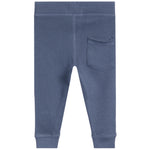 Blue textured waffle-knit pants with a back pocket, shown from the back on a white background.