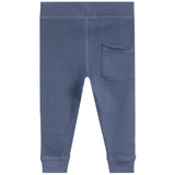 Blue textured waffle-knit pants with a back pocket, shown from the back on a white background.