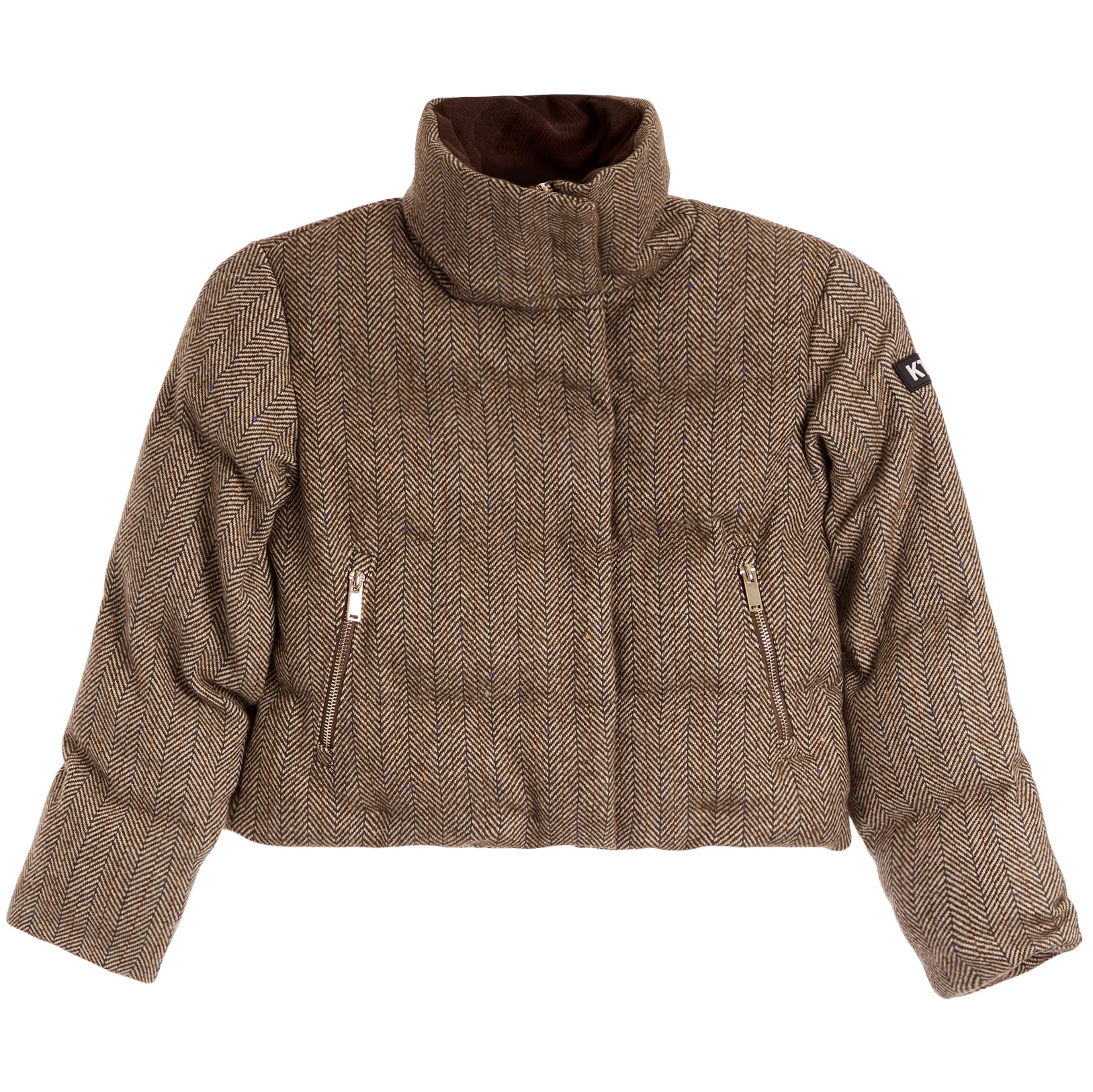 A cropped, high-collar puffer jacket in a brown and beige herringbone pattern, featuring two zippered pockets on the front and a small black brand patch on the upper right sleeve.
