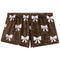 A pair of women's shorts featuring a brown leopard print pattern with white bow motifs repeated across the fabric, shown against a plain white background.