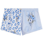 A pair of folded light blue pajama shorts on a white background. One leg features a blue leopard print pattern, and the other leg has a blue floral bouquet print on a light blue background.