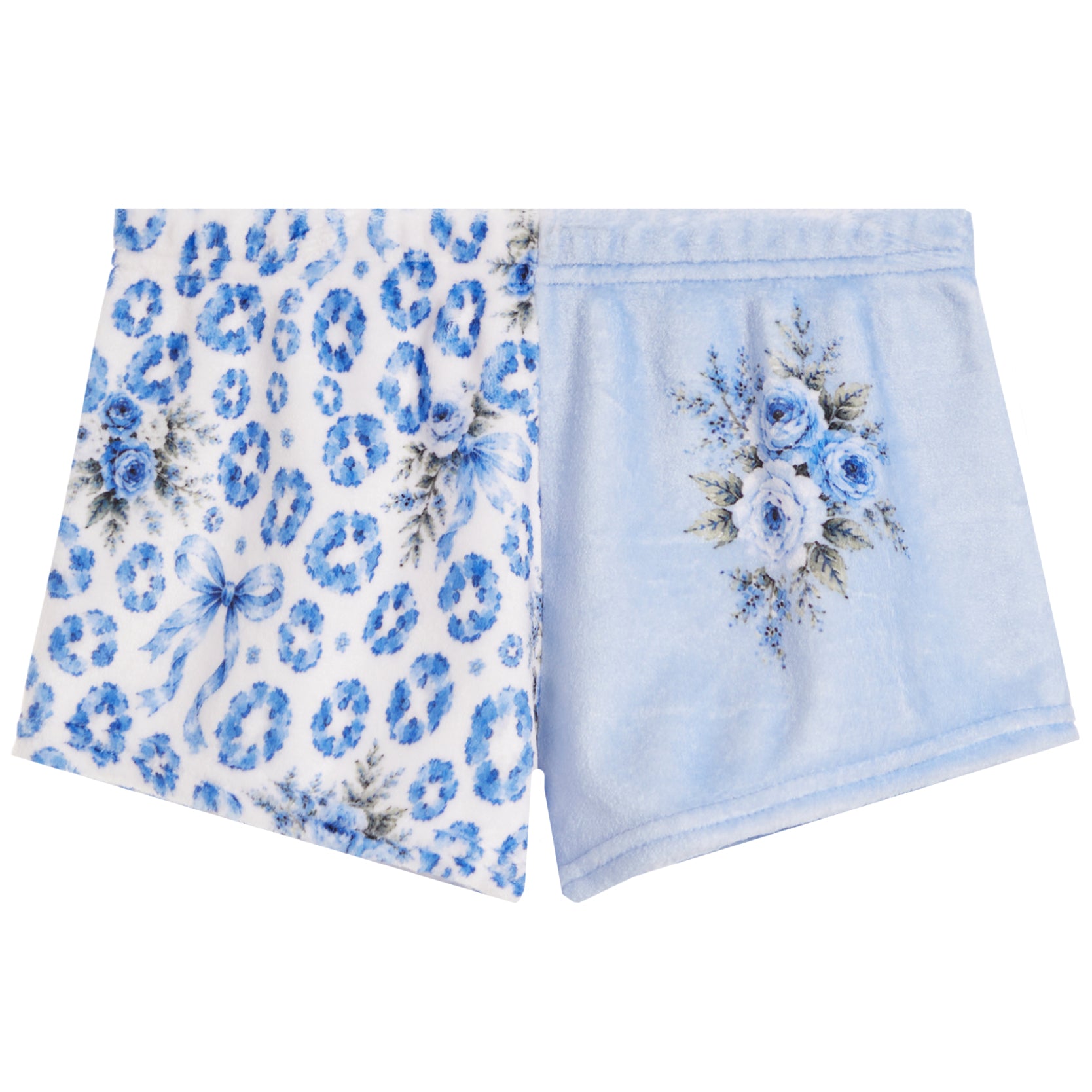 A pair of folded light blue pajama shorts on a white background. One leg features a blue leopard print pattern, and the other leg has a blue floral bouquet print on a light blue background.