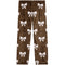 A pair of children's leggings featuring a brown leopard print pattern with white bow motifs repeated all over the fabric, shown flat against a solid white background.