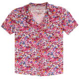A short-sleeve button-up pajama shirt with a vibrant pink and multicolor abstract pattern, displayed flat against a white background.