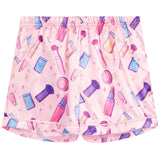 Pink pajama shorts with a colorful cosmetic-themed print featuring lipsticks, makeup brushes, sponges, and compacts, shown flat against a white background.