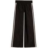 Black wide-leg track pants with double white stripes down the sides, shown flat against a white background.