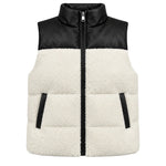 A colorblock puffer vest with a black faux-leather upper panel and collar, and a cream sherpa fleece lower body, featuring a front zipper and zippered hand pockets.