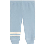 Light blue waffle-knit jogger pants with ribbed cuffs and two horizontal cream stripes near the lower left leg, shown flat against a white background.