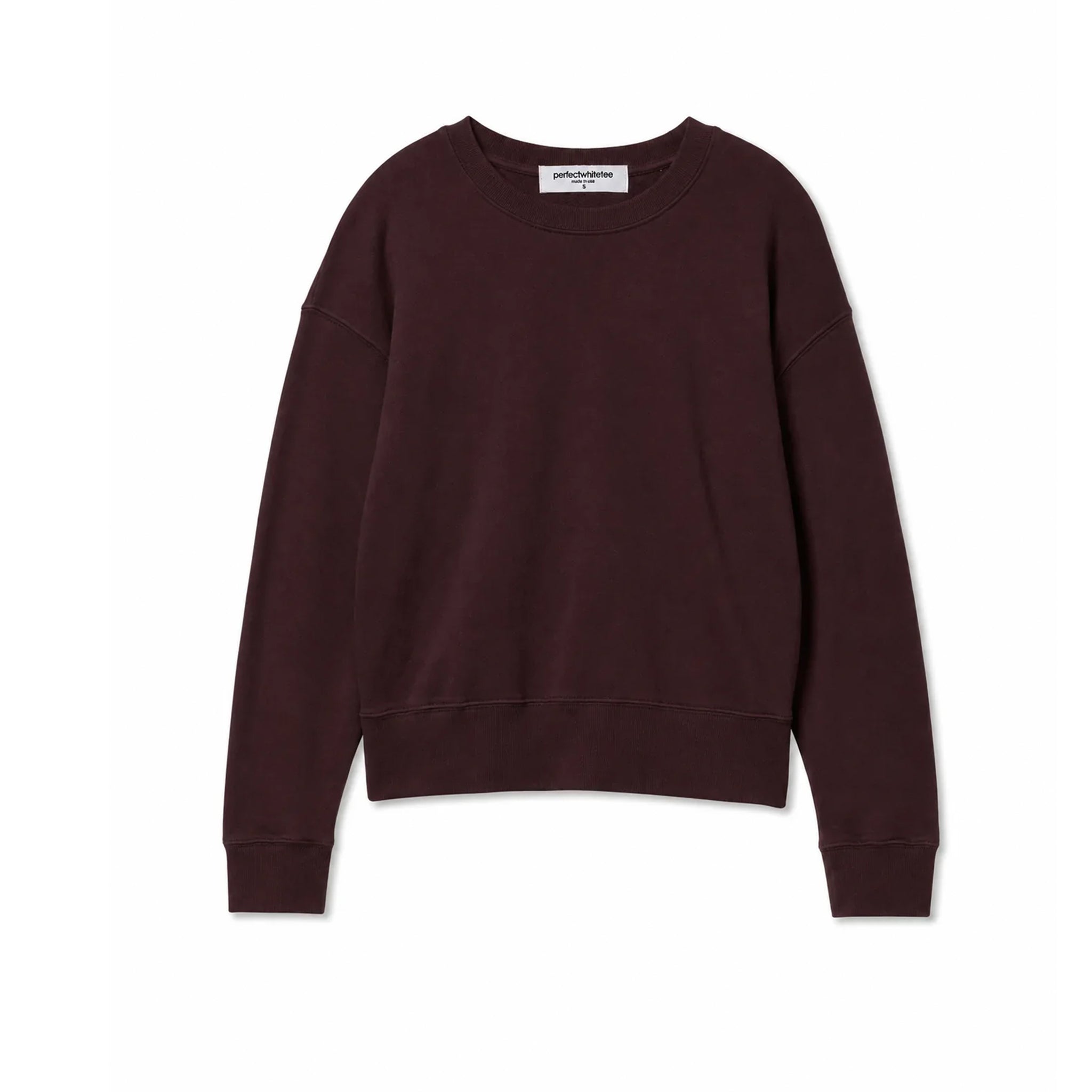 A dark burgundy crewneck sweatshirt with long sleeves and ribbed cuffs and hem, laid flat against a white background. 