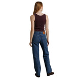 A woman shown from the back wearing blue jeans, a dark brown sleeveless top, and brown shoes against a plain white background.