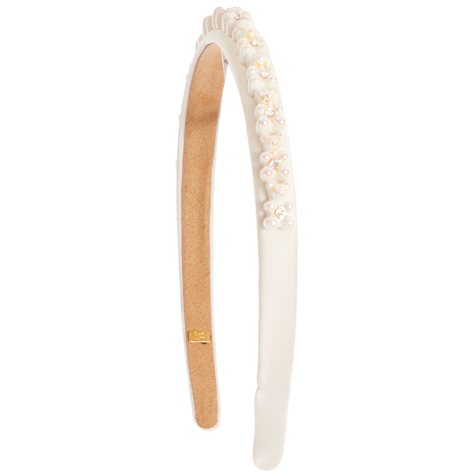 An off-white fabric headband with a ruffled trim, decorated with small white and iridescent floral beads along one side, and a tan adjustable inner band with a small gold metal clasp.