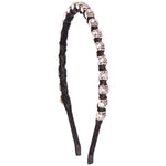 A black headband embellished with a row of clear rhinestones set in silver-toned metal along the top curve, shown against a plain white background.
