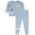 A toddler's two-piece waffle-knit lounge set in light blue, featuring a long-sleeve top with cream stripes on the sleeves and a sports-themed patch on the chest, paired with matching leggings that have cream stripes near the ankles.