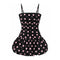 A black retro-style dress with pink polka dots, featuring a structured bustier top and a flared ruffled skirt, shown against a plain white background.